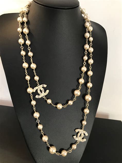 chanel logo necklace men|chanel long pearl logo necklace.